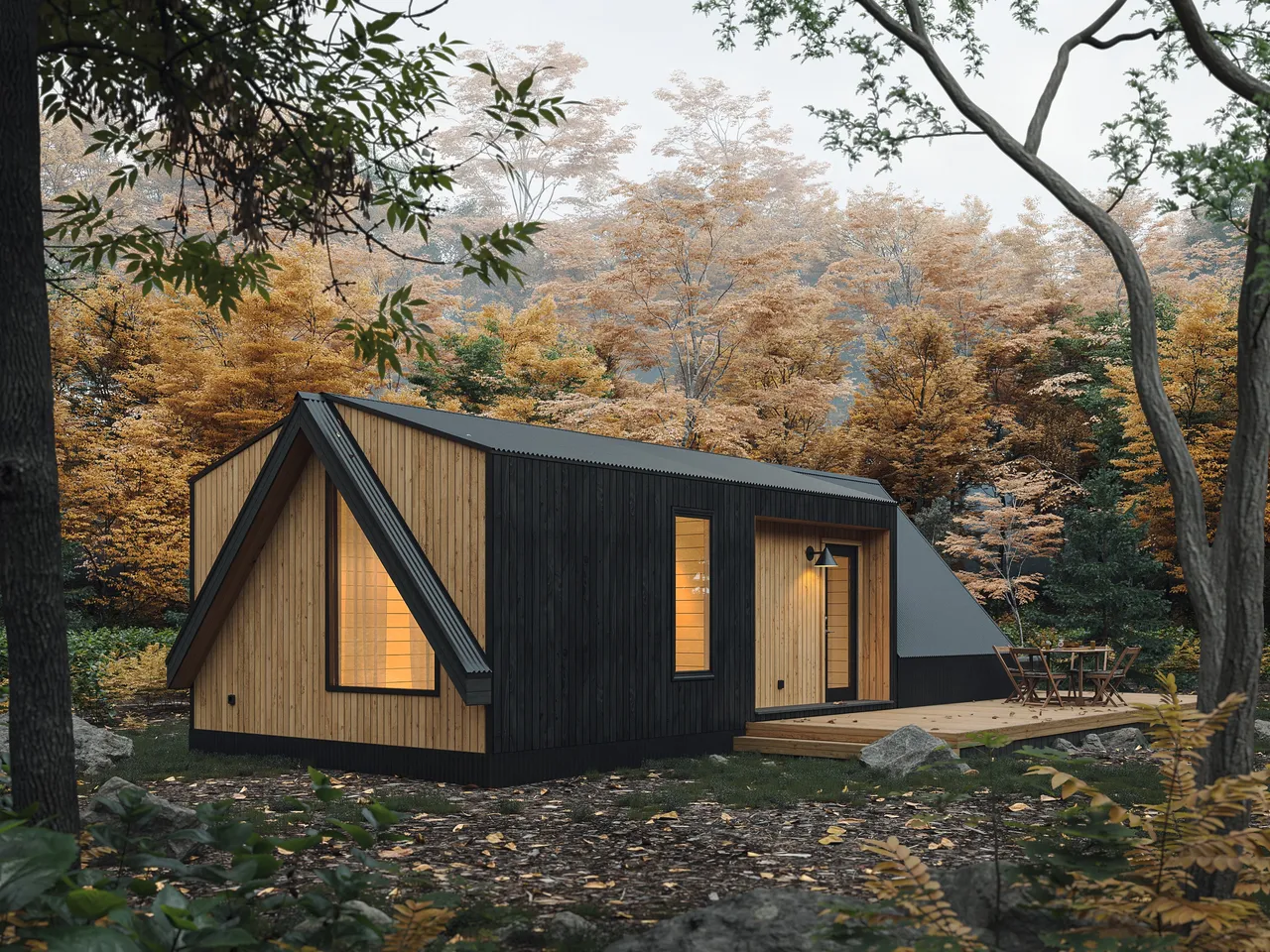 Modern A-frame inspired cabin with dark and natural wood cladding, large windows, and a wooden deck, nestled in a forest with autumn foliage.